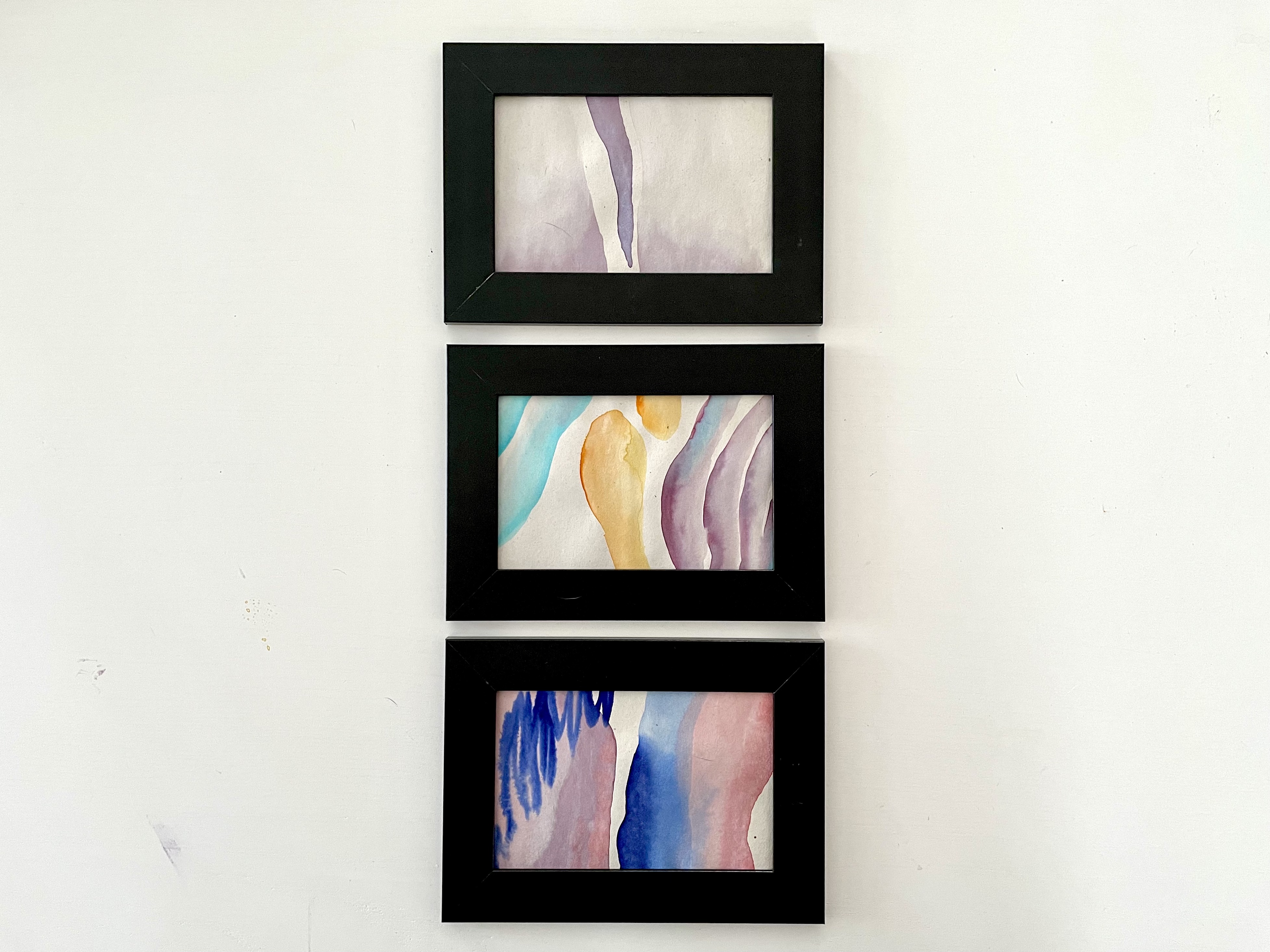 Three framed watercolor pictures on a white background