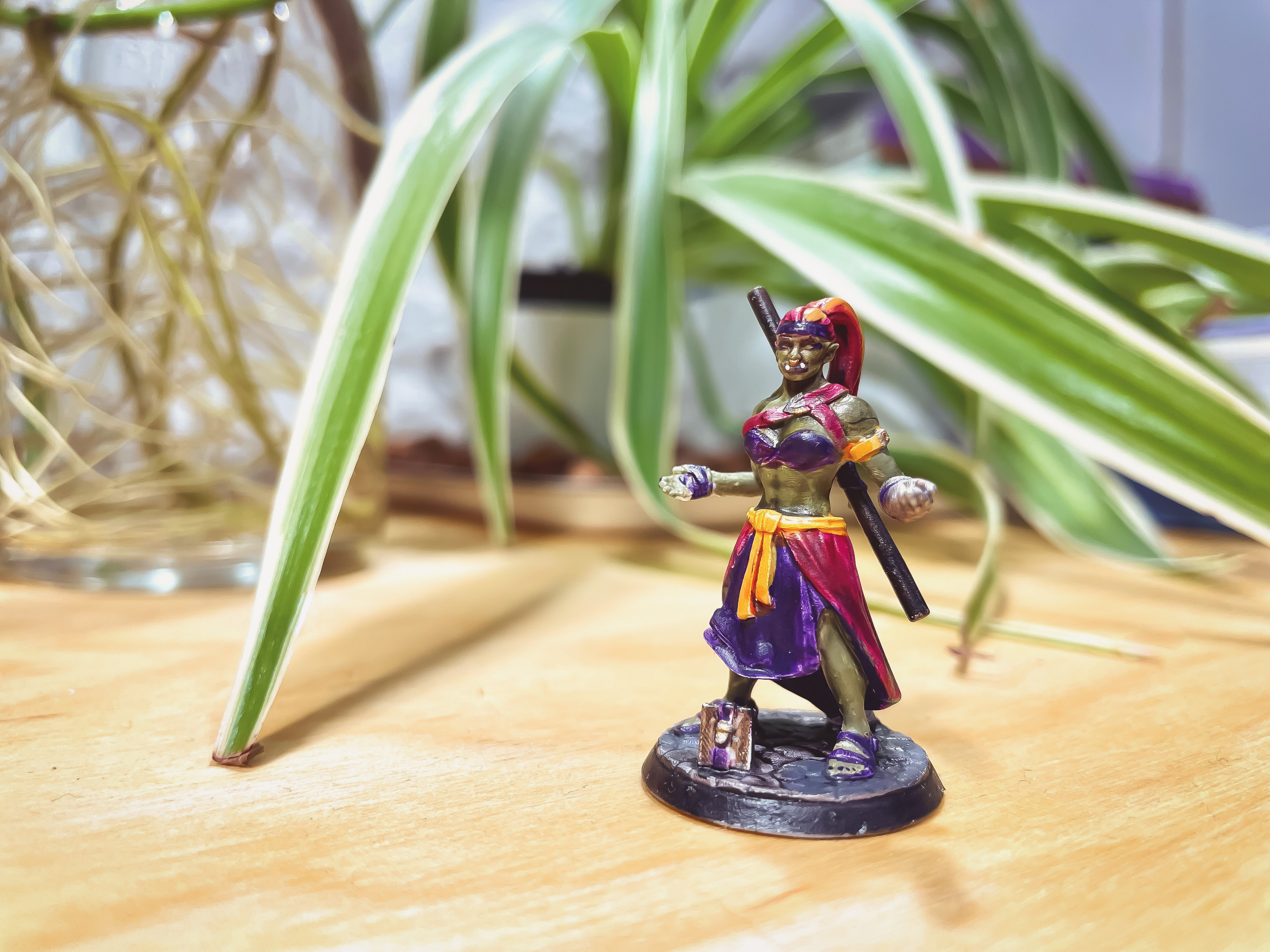 Hand-painted D&D miniature of a brawny half-orc monk lady